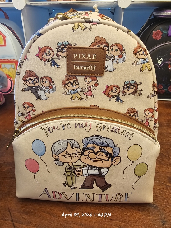 Loungefly Handbags - Loungefly Pixar Cream Kids Backpack with Colorful Character Print